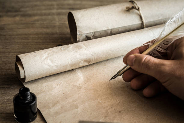 Quill pen writing on parchment